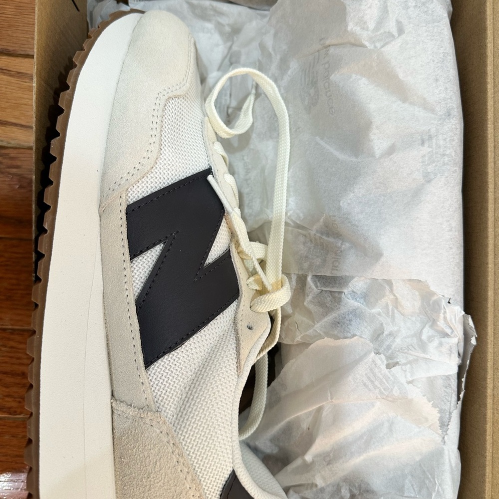 New Balance Cream and Black Sneakers
